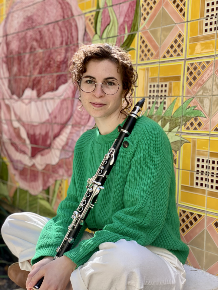 headshot of clarinetist Logan Lambert holding clarinet